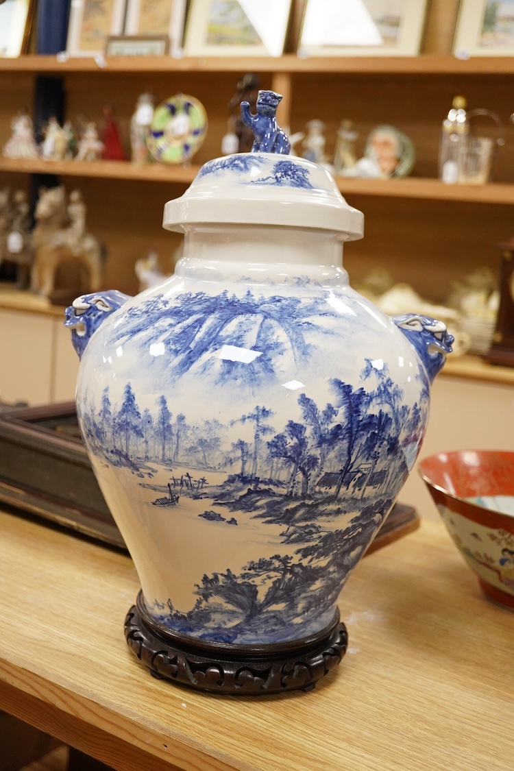 A Chinese blue and white ovoid shaped vase and cover on stand and a Japanese Kutani bowl decorated with figures, largest 46cm high